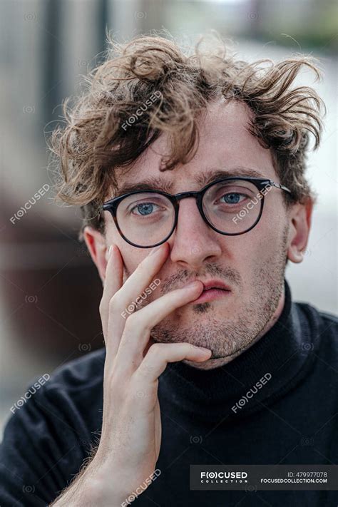 Close Up Portrait Of Sad Young Man Sitting Outdoors — Emotional Stress