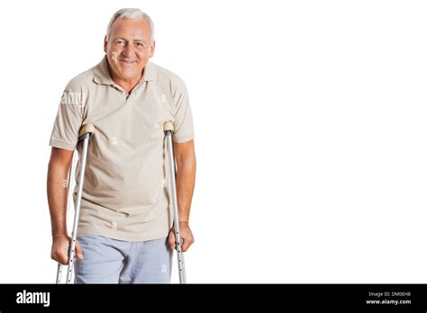 Senior Man On Crutches Stock Photo Alamy