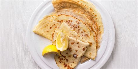 Pancakes Folded Into Quarters On A Plate With Lemon And Sugar Bbc