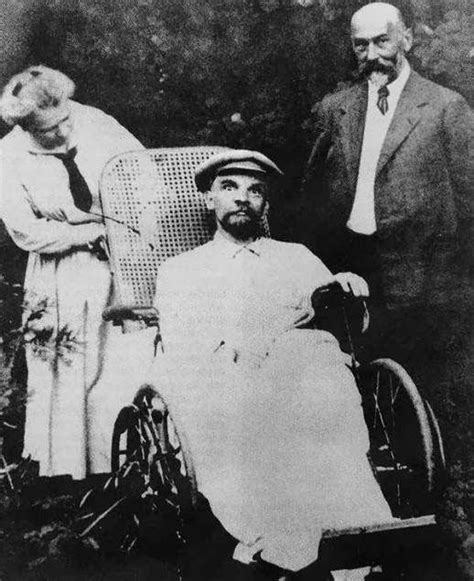 An Old Black And White Photo Of A Man In A Wheelchair Next To Two Women