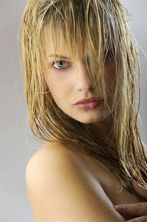 girl with wet hair and beautiful blond girl with long wet hair on her face look affiliate