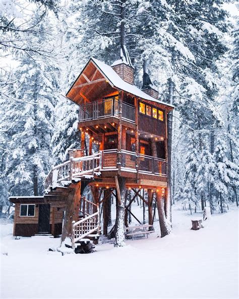 Secluded In The Snow Covered Forest This Cozy Treehouse Was The