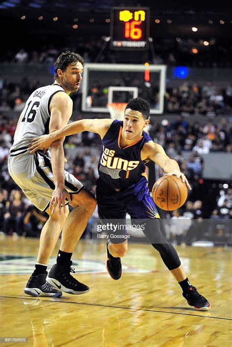 Devin Booker Of The Phoenix Suns Handles The Ball During The Game