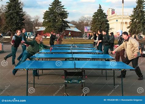 Outdoor Table Tennis Group Of People Are Playing In The Park In The