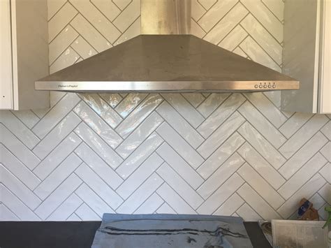'we're finding that a dark grey grout is particularly popular with a classic white metro tile,' says sian o'neill. Subways; A refreshing look from the underground