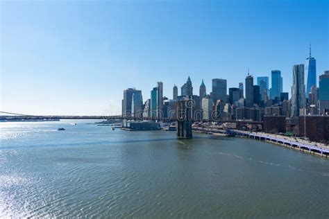 The Brooklyn Bridge And The Lower Manhattan New York City Skyline Along