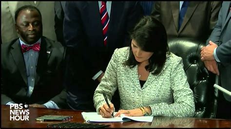 S C Gov Nikki Haley Signs Bill To Remove Confederate Flag From State Capitol Youtube