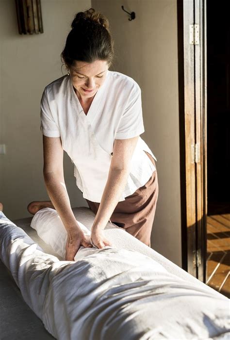 female massage therapist giving a massage premium photo rawpixel