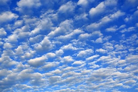 Premium Photo Puffy Clouds On Blue Sky Background