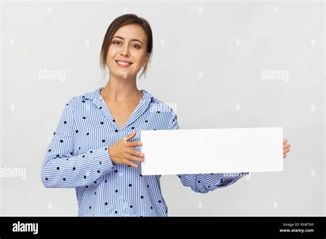 Smiling Beautiful Woman Holding Empty Signboard Isolated On White Wall Stock Photo Alamy