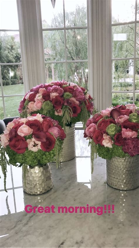 Three Silver Vases Filled With Pink And Red Flowers