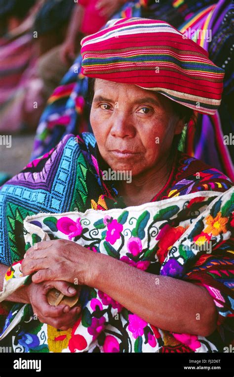 Mayan Woman Wearing Traditional Brocade Huipils In Marketplace