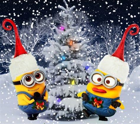 Two Minion Characters Dressed As Santa Hats In Front Of A Snow Covered
