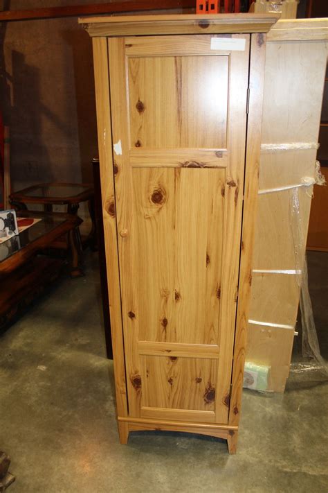 Two cabinets with doors each open to reveal 2 shelves that provide discreet spaces for canned goods, books or toiletries. TALL PINE STORAGE CABINET