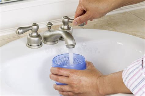 Pouring Water Into Cup From Bathroom Sink Stock Image Image Of House Closeup