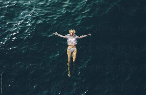 Woman Into Water By Stocksy Contributor Simone Wave Stocksy