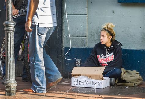 Young Homeless Girl Panhandles On Bourbon Street In New Orleans