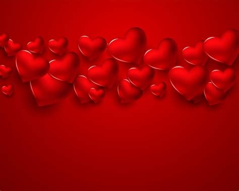 Cartão de dia dos namorados com corações 3d vermelhos Vetor Grátis
