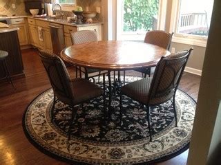 The clean lines of a square rug, however, tie in with boxy chairs or a modern chandelier with square shades. Need help on what shape rug to put under round kitchen ...