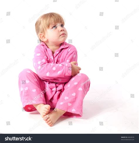 Sitting On The Floor Little Girl In Pink Pajamas Stock