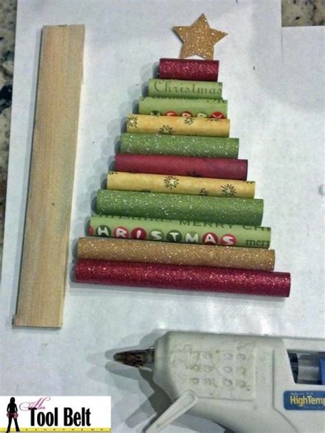 A Christmas Tree Made Out Of Rolled Up Wrapping Paper And Some Glue On