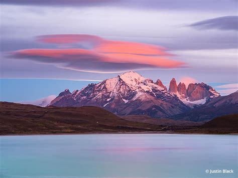 Lenticular Clouds Catching Alpenglow And Moonlight Over The Paine