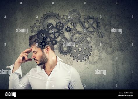 Serious Young Man Thinking Very Hard Solving A Problem Stock Photo Alamy