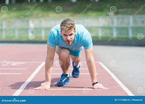 Man Runner On Start Position At Stadium Runner In Start Pose On