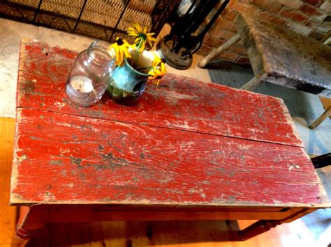 A coffee table is the focus of any living room furniture layout and creates the perfect spot for entertaining. Aged red coffee table | Casitas