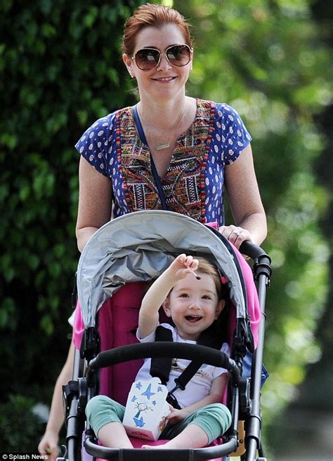 alyson hannigan takes daughter keeva out in her stroller with husband alexis in la daily mail