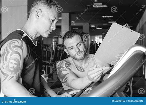 Personal Trainer Instructing Sportsman Stock Image Image Of Young