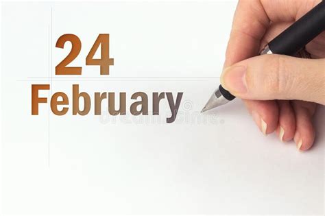 February 24th Day 24 Of Month Calendar Date The Hand Holds A Black