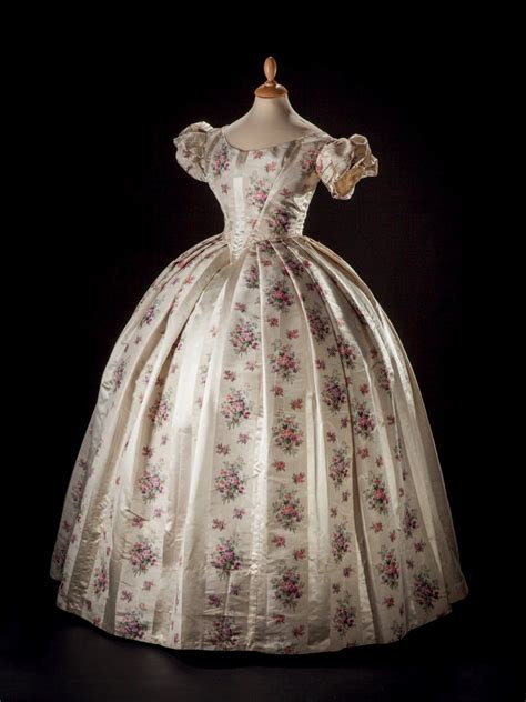 The pale cerulean blue and cream striped fabric is embroidered with flowers and butterflies in the stripes. Ball gown ca. 1860 From Drouot | Historical dresses, Old ...