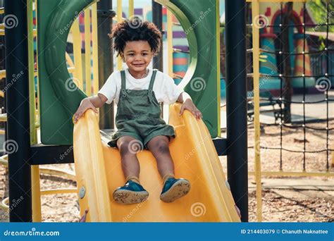 Happy Black People Child Playing Slide In Playground Royalty Free Stock