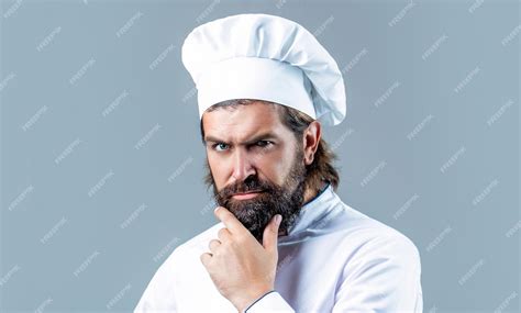 Premium Photo Serious Cook In White Uniform Chef Hat Portrait Of A Serious Chef Cook
