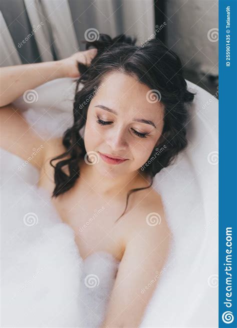Relaxing Beautiful Woman Lying In A Spa Bath With Foam Spa Concept Stock Image Image Of