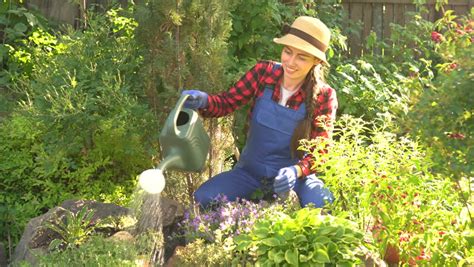 We pride ourselves in our excellent organisation, our high tech logistics, and our commitment to offering our. Happy Young Woman Gardener in Stock Footage Video (100% ...