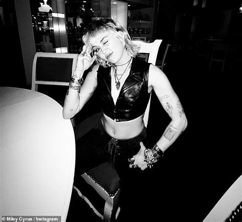 Miley Cyrus Flips Off The Camera In Edgy Black And White Snaps Taken By