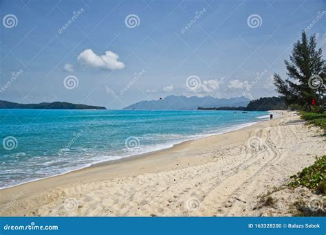 Waves Of The Azure Andaman Sea Under The Blue Sky Reaching The Shores