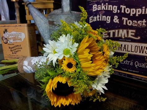 Many wildflowers also can be included in sunflower bouquets to really bring a touch of nature into any space. Sunflowers and daisies bridal bouquet | Sunflowers and ...