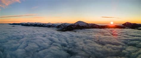 Premium Photo Aerial View Of Vibrant Sunrise Over White Dense Fog