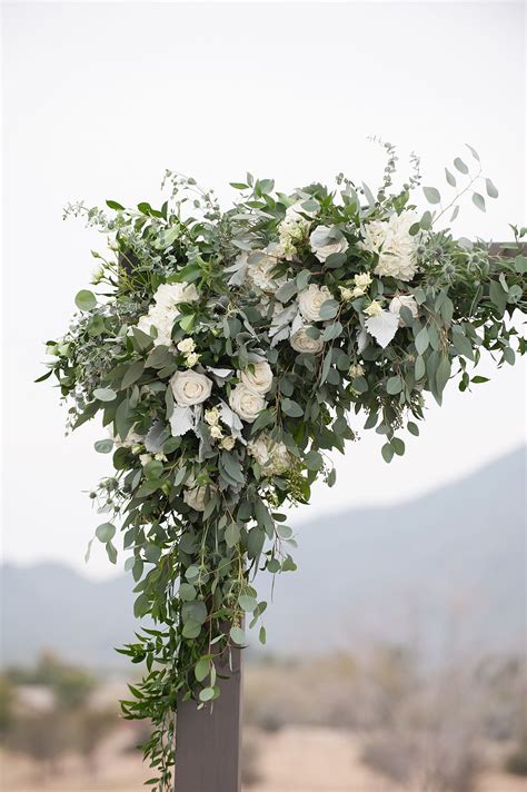 Wooden Wedding Arch With White Flowers And Greenery Wedding Arch