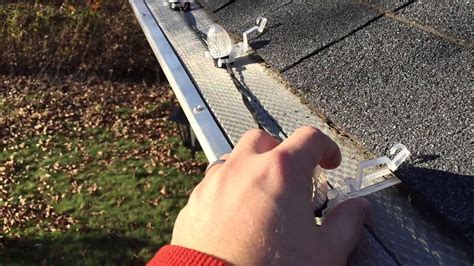 Installing Christmas lights with gutter guards - YouTube