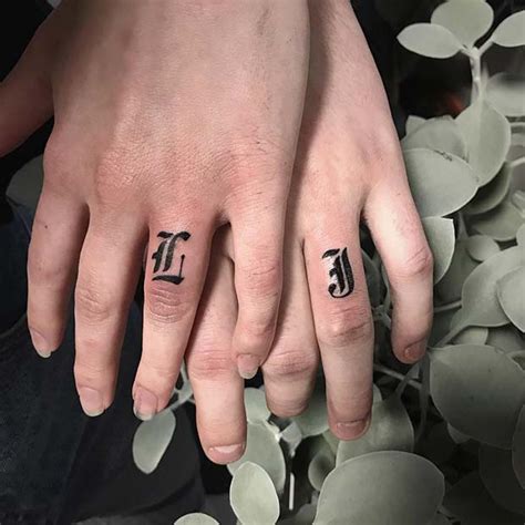 Here, the wearer has combined some beautiful shaded feathers with the initials m letter tattoo design to make it look much more charming than it was previously before. 43 Cool Finger Tattoo Ideas for Women | Page 2 of 4 | StayGlam