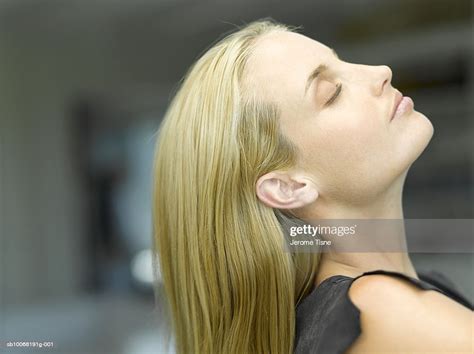 Woman Tilting Head Back Side View Close Up Stock Photo