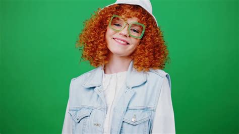 Cute Playful Young Redhead Lady In Eyeglasses And Panama Hat Sending