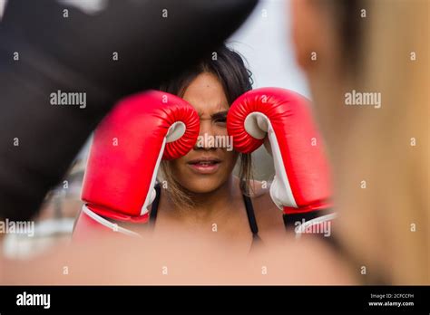 Multiethnic Brutal Female Fighters In Boxing Gloves Training Punches