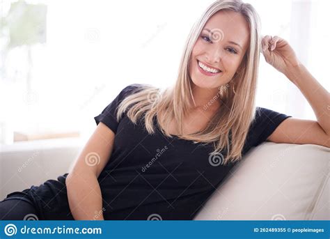 Its More Than A House Its A Home Portrait Of A Young Blonde Woman Sitting On Her Sofa At Home