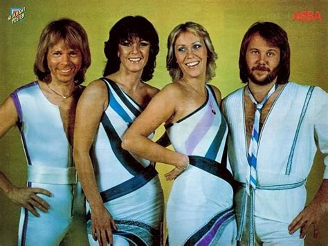 The Bee Gees Are Posing For A Photo In Their White And Blue Outfits