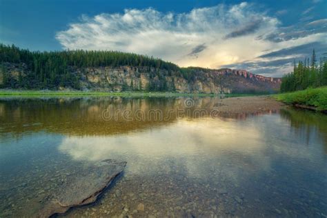Cloud Over The Rocky Bank Of The Taiga River River Amga Stock Image